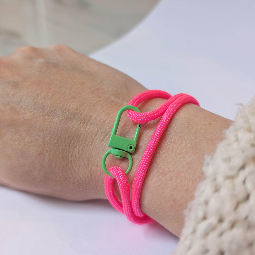 Neon Pink Adjustable Paracord Bracelet with Green Clasp
