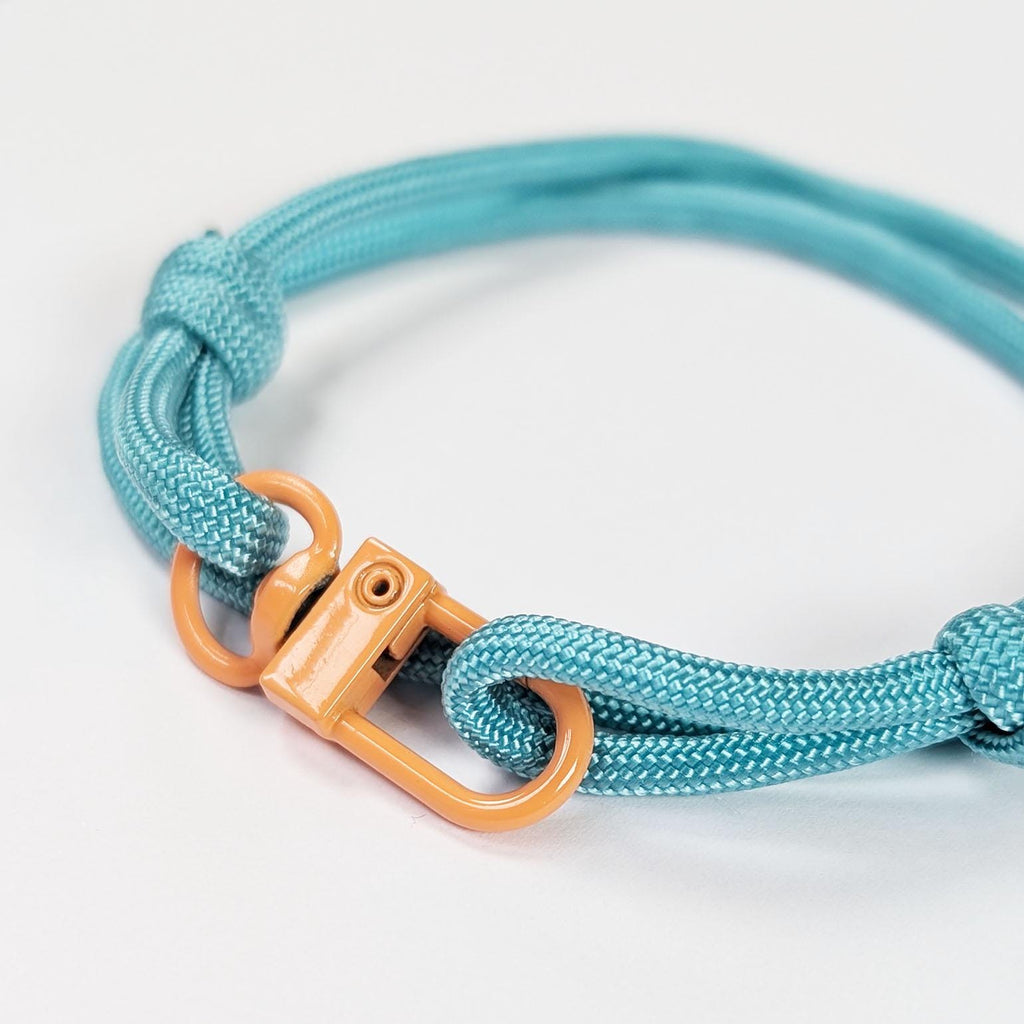 Turquoise Adjustable Paracord Bracelet with Orange Clasp