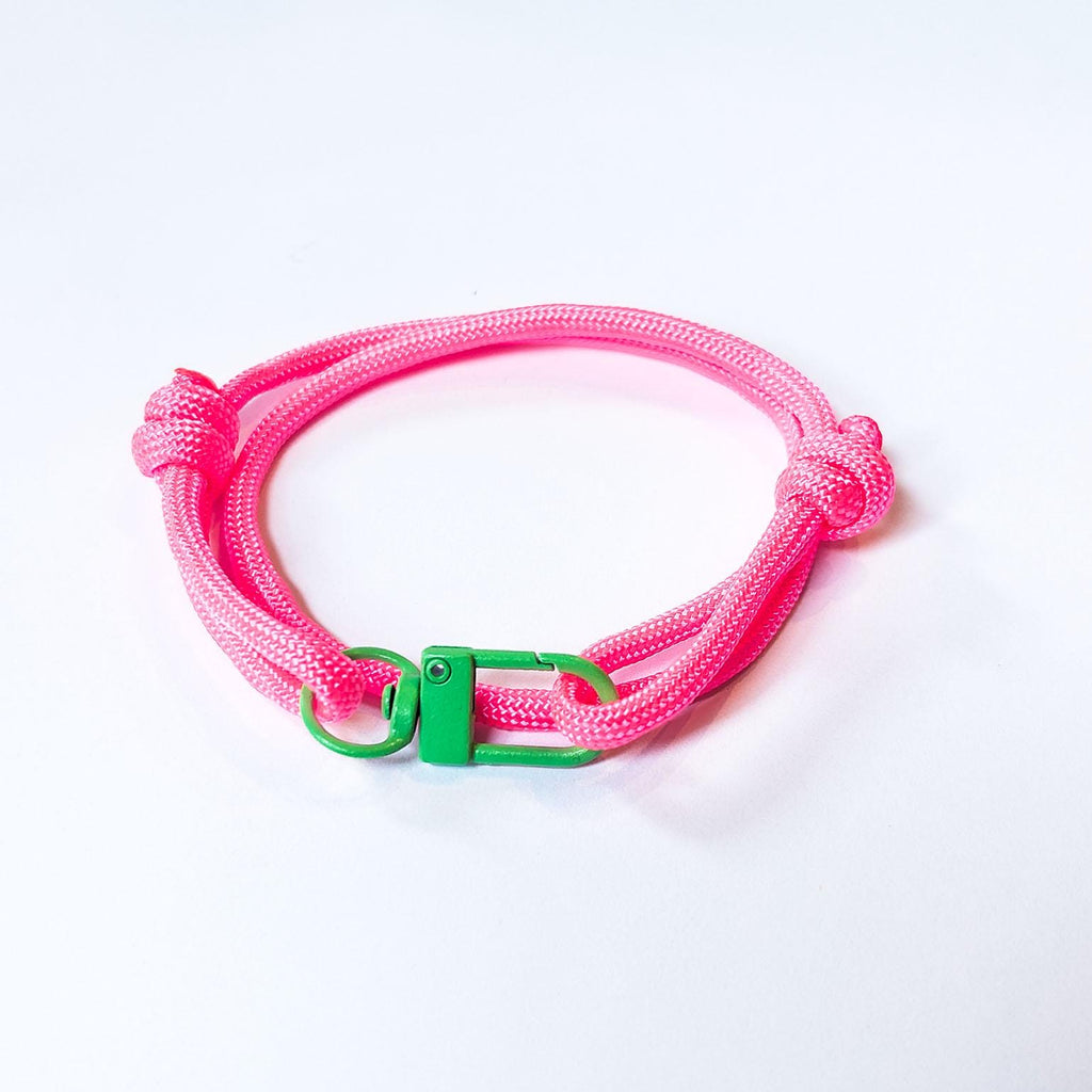 Neon Pink Adjustable Paracord Bracelet with Green Clasp