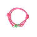 Neon Pink Adjustable Paracord Bracelet with Green Clasp